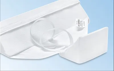 A white wedge-shaped pillow with a white fabric cover, designed for side sleeping.