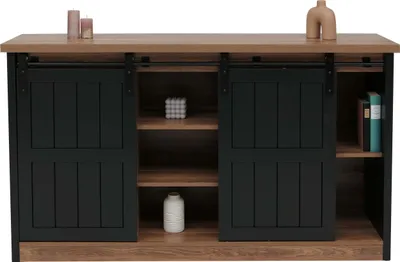 A sideboard with sliding doors and shelves, decorated with candles and vases.