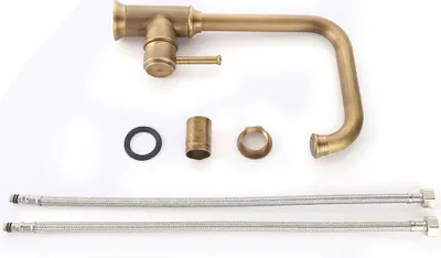 A collection of faucet parts laid out on a white background.