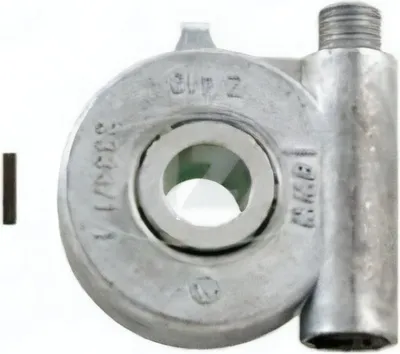 A close-up, front-facing view of a silver-colored metal speedometer drive unit, with a small metal pin to its left.