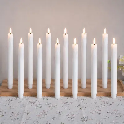 Immagine prodotto di 12 candele a LED a forma di stecca, luce bianco caldo, 19 cm, senza fiamma, alimentate a batteria, ideali per decorazioni natalizie, matrimoni, feste e altri eventi, colore bianco