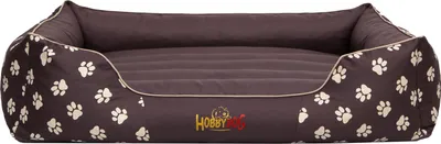 A brown dog bed with a paw print pattern and a beige trim, shown from a slightly elevated front-facing angle against a white background.