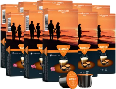 Multiple boxes of Martello coffee capsules are stacked together, with a sunset beach scene on the packaging.