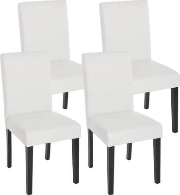 Four white dining chairs with dark legs are arranged in a studio setting against a white background.