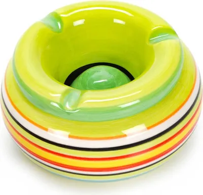 A close-up studio shot of a colorful ceramic ashtray.
