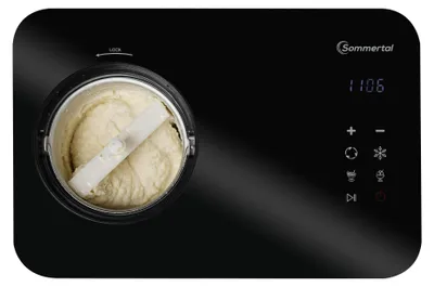 A top-down view of an ice cream maker with the lid open, showing the ice cream inside and the mixing paddle. The control panel with a digital display and buttons is visible on the right.