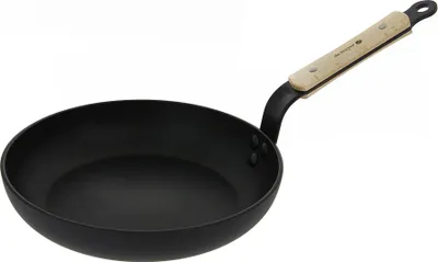A black frying pan with a light-colored wooden handle is shown against a white background.