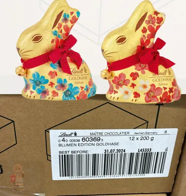 Image de Lindt Lapin en chocolat doré 12x 200 g Lapin de Pâques Bunny Lapin Clochettes Fleurs Édition 2,4 kg