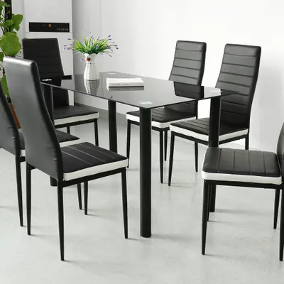 A dining table with chairs in a room.