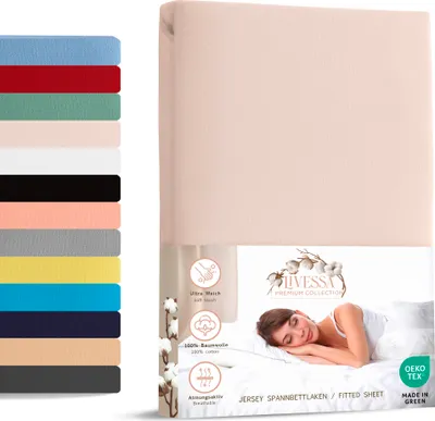 A folded fitted sheet is shown next to a display of various colored fitted sheets, with a woman sleeping on a bed in the background.