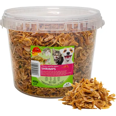 A large plastic tub filled with dried shrimp, with a label showing various pets and product information.