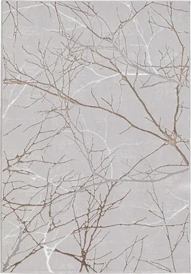 A close-up view of a rug with a pattern of tree branches.