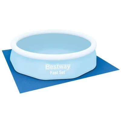 An inflatable pool with a blue ground mat.