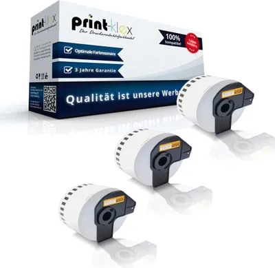A product shot of three label rolls and a box of label rolls, presented on a white background.