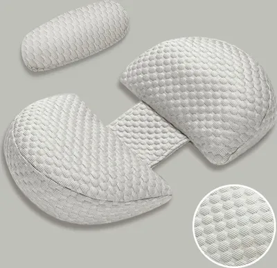 A light gray pregnancy pillow and a smaller support pillow are arranged on a light gray background.
