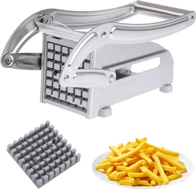 A potato slicer with a set of blades and a plate of french fries.