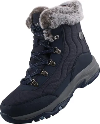 A single navy blue Skechers boot with gray accents and faux fur trim is shown against a white background.