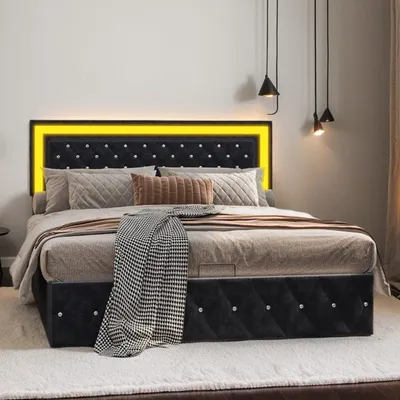 A bedroom scene featuring a bed with LED lighting.