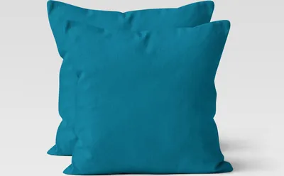 Two teal pillowcases are shown against a white background.