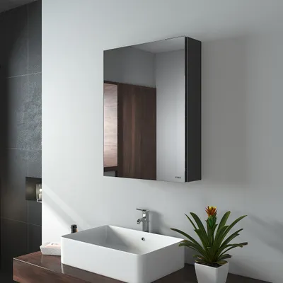 A modern bathroom with a sink, faucet, and a medicine cabinet with a mirror.