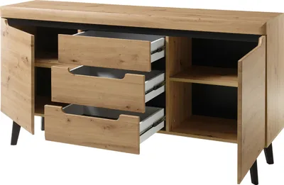 A wooden sideboard with three open drawers and one open cabinet door, showing its interior shelves.