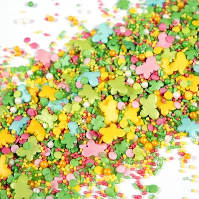 Produktbild von Streuselheld Schmetterlingszauber 40g Streudekor Mischung mit Schmetterlingen Kleeblättern und Zuckerperlen in Pastellfarben für Torten und Cupcakes
