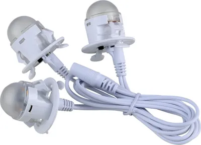 Three white LED lights with wires on a white background.
