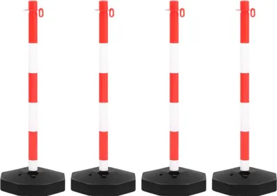 Four red and white striped stanchions with black bases are arranged in a row against a white background.