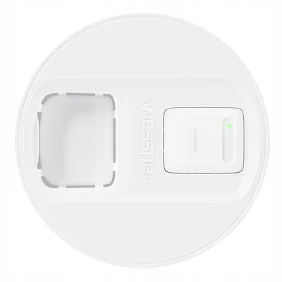 A top-down view of a white lid with a green LED indicator light and a rectangular slot.
