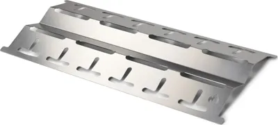 A stainless steel heat reflector for a grill, shown from a diagonal angle against a white background.