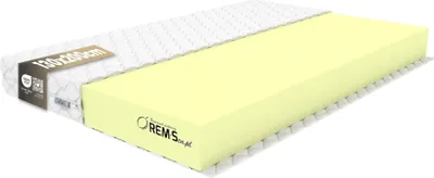 A mattress is shown with one half covered by its white fabric and the other half revealing its yellow foam core.