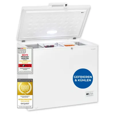 A white chest freezer with its lid open, showing internal compartments and some food items. Several award badges and a circular graphic are affixed to the front of the freezer.