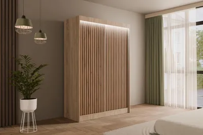 A modern bedroom with a large wardrobe, plant, and window with curtains.