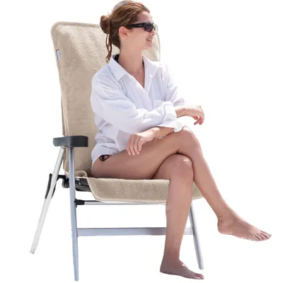 A woman is sitting on a beige garden chair with a towel cover.