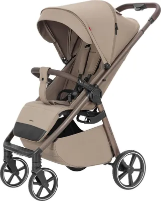 A studio shot of a beige stroller against a white background.
