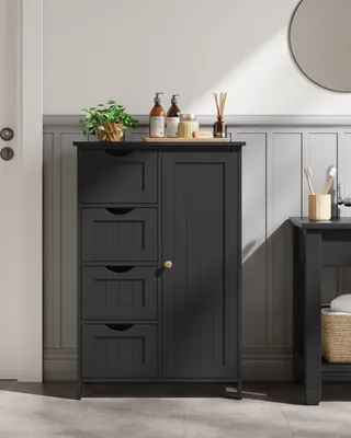 A dark gray bathroom cabinet with four drawers and a single door, placed in a bathroom setting with wainscoting and a mirror visible.