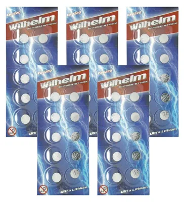 Multiple blister packs of CR1220 lithium coin cell batteries, arranged in a grid.