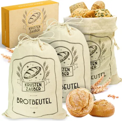 A set of three linen bread bags with bread and a box.