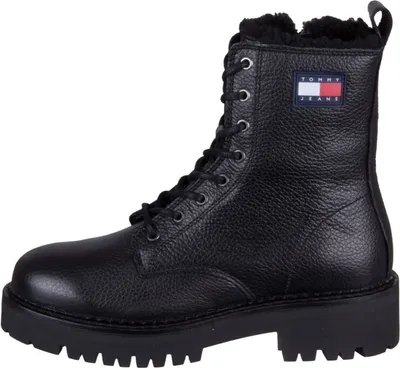 A black Tommy Jeans boot on a white background.