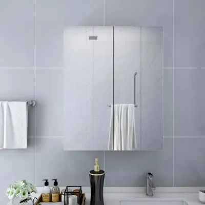 A bathroom scene featuring a mirrored cabinet, towels, and a soap dispenser.