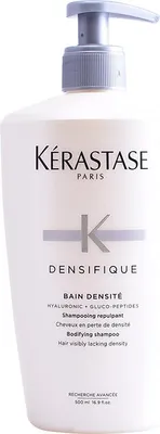 A white bottle of Kérastase Densifique Bain Densité shampoo with a pump dispenser.