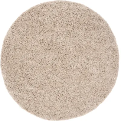 A round, beige rug is shown from a top-down perspective on a white background.