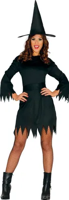 A woman dressed in a witch costume, posing against a white background.