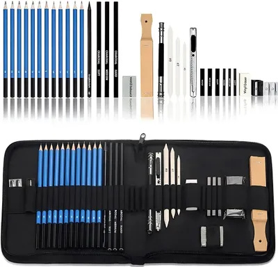 A set of drawing and sketching tools laid out on a white background, with a closed case shown below.