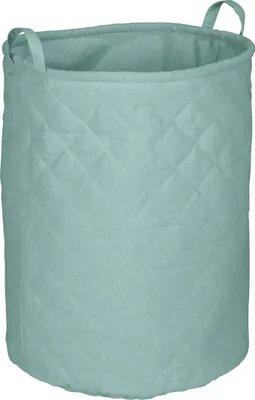 A sage-colored quilted laundry basket with handles.