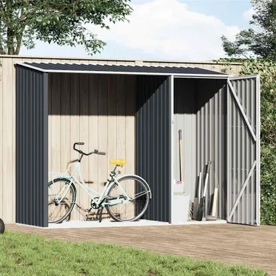 A bicycle and garden tools are stored in a metal shed.