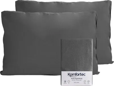 Two dark gray pillowcases are shown, with a small package in front of them.