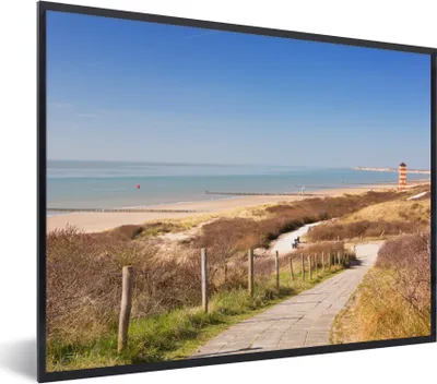 Produktbild von MuchoWow® Gerahmtes Poster Strand - Meer - Leuchtturm - Niederlande 40x30 cm - Poster mit Schwarzem Bilderrahmen Wandposter Rahmen Foto Bilder - Kunstposter - Wanddekorationen