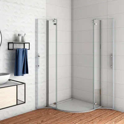 A modern bathroom corner with a glass shower enclosure, a vanity with a sink, and a towel rack with a blue towel.