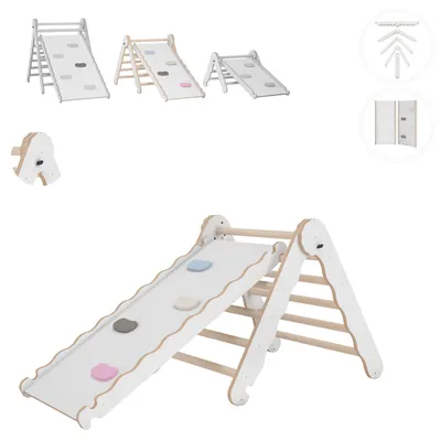 A white and wood indoor climbing structure for babies and children, with colorful climbing holds.